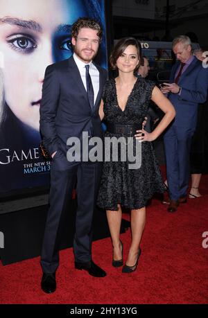 Richard Madden and Jenna-Louise Coleman attending the season 3 premiere of the show 'Game Of Thrones' in Hollywood, California. Stock Photo