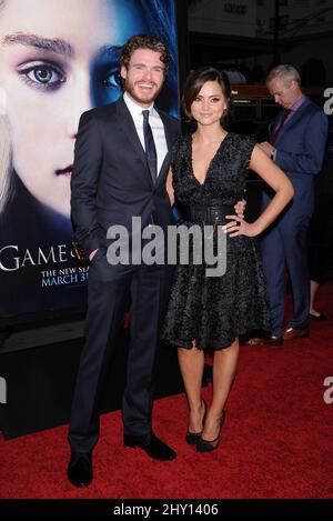 Richard Madden and Jenna-Louise Coleman attending the season 3 premiere of the show 'Game Of Thrones' in Hollywood, California. Stock Photo