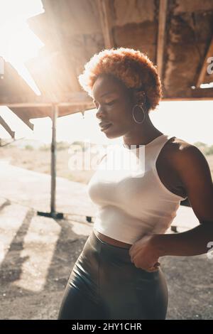 Beautiful African-American woman with dyed hair and under-eye patches ...