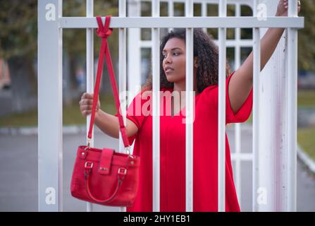 Focused young African American female freelancer sitting and browsing laptop while working remotely on project at home Stock Photo