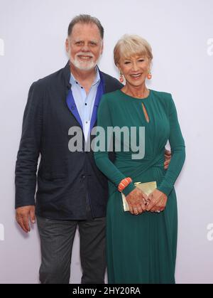 Helen Mirren & Taylor Hackford arrives at the LA premiere of 'Red 2' at the Westwood Village on Thursday, July 11, 2013, in Los Angeles. Stock Photo