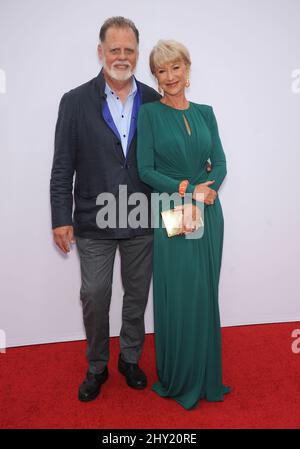 Helen Mirren & Taylor Hackford arrives at the LA premiere of 'Red 2' at the Westwood Village on Thursday, July 11, 2013, in Los Angeles. Stock Photo