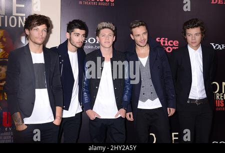 Louis Tomlinson, Niall Horan, Zayn Malik, Liam Payne and Harry Styles of One Direction attending the 'One Direction: This Is Us' Premiere in New York. Stock Photo