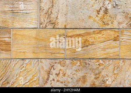 Geologic crossbedding features visible in detail shot of architectural sandstone building blocks on a wall Stock Photo