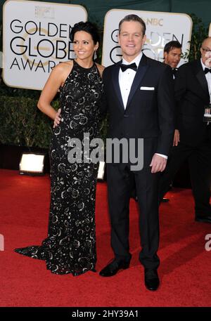 Matt Damon & Luciana Barroso attend the 71st Annual Golden Globe Awards, held at the Beverly Hilton Hotel on January 12, 2014. Stock Photo