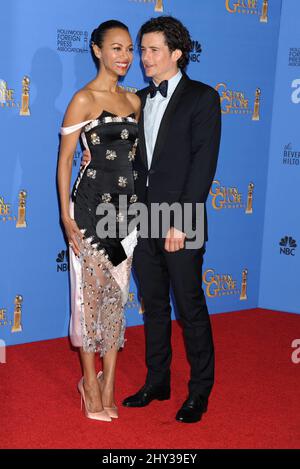 Zoe Saldana and Orlando Bloom in the press room of the 71st Annual Golden Globe Awards, held at the Beverly Hilton Hotel on January 12, 2014. Stock Photo