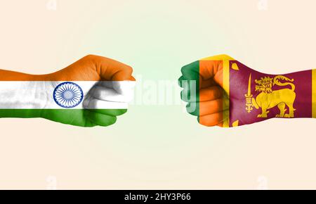 Fist to fist with illustrated India and Sri Lanka flags. Stock Photo