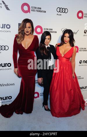 Khloé Kardashian, Kourtney Kardashian and Kim Kardashian arriving for the 2014 Elton John AIDS Foundation Academy Awards Viewing Party held at West Hollywood Park, Los Angeles.  - The 22nd Annual Sir Elton John Oscar Party - Los Angeles. Stock Photo