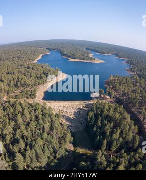 Beautiful view of Willow Springs Lake with a forest on a sunny day Stock Photo
