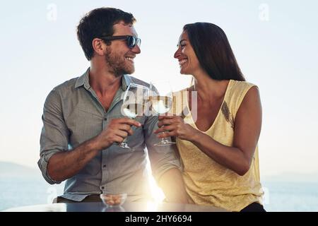 Heres to having the best partner. Cropped shot of a happy couple out on a romantic date. Stock Photo
