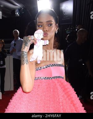 rihanna pink dress grammy 2015 GRAMMY's: Rihanna hits the red carpet in a HUGE pink dress
