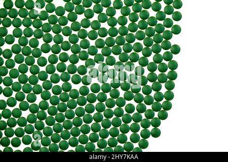 Chlorella algae green tablets on white background.Super food. seaweed dietary supplements.Pressed Chlorella Powder Tablets.Spirulina algae Stock Photo