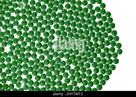 Spirulina algae. Chlorella algae green tablets isolated on white background.seaweed dietary supplements. Chlorella Powder Tablets. Alternative Stock Photo