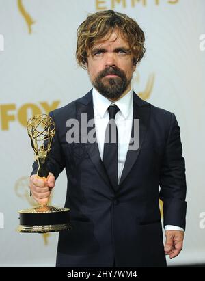 Peter Dinklage poses in the press room at the 67th Primetime Emmy Awards on Sunday, Sept. 20, 2015, at the Microsoft Theater in Los Angeles. Stock Photo