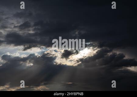 Dark clouds with rays . Heaven before heavy rain Stock Photo