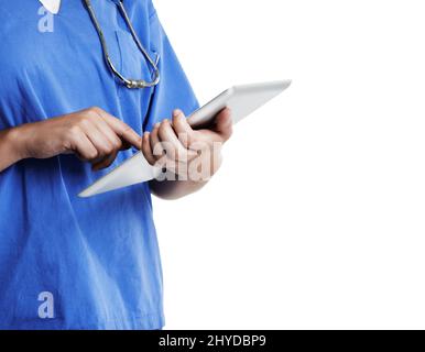 Medical records on the move. Cropped studio shot of a doctor using a digital tablet against a white background. Stock Photo