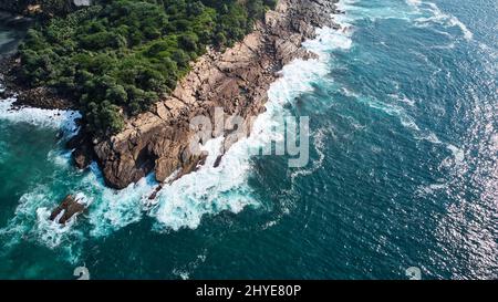 aerial view of the rocks against which the powerful waves of the Indian Ocean break Stock Photo