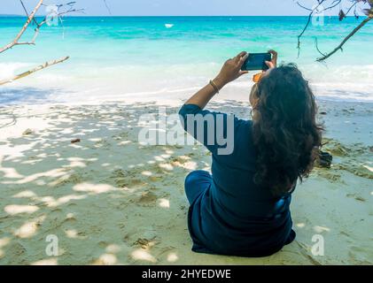 woman on the beach, Kalapathar Beach, Havelock Island, India Stock Photo