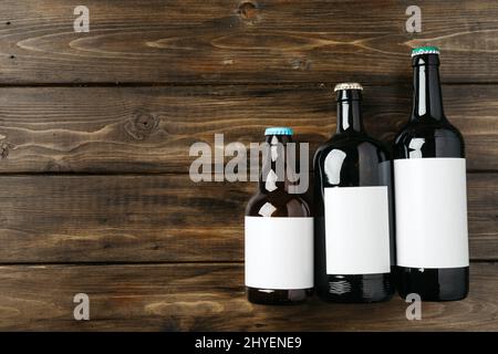 Beer bottle on a brown wooden table flat lay background with a copy space Stock Photo