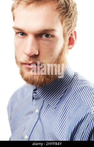 Rugged confidence. Portrait of an unshaven young man isolated on white. Stock Photo