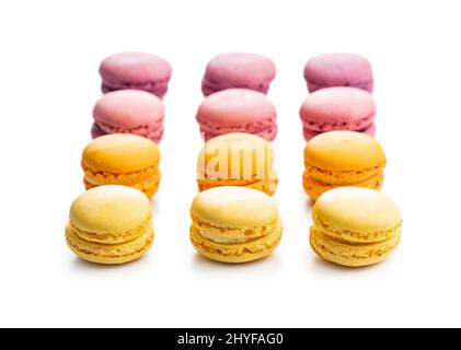 Sweet colorful macarons. Traditional french macaroons. Tasty dessert isolated on white background. Stock Photo