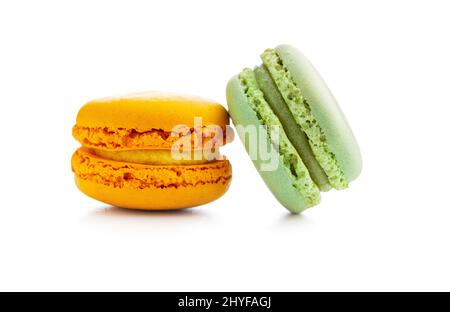 Sweet colorful macarons. Traditional french macaroons. Tasty dessert isolated on white background. Stock Photo