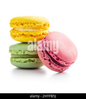 Sweet colorful macarons. Traditional french macaroons. Tasty dessert isolated on white background. Stock Photo