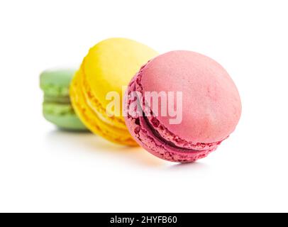 Sweet colorful macarons. Traditional french macaroons. Tasty dessert isolated on white background. Stock Photo