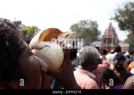 Chennai, Tamil Nadu, India. 15th Mar, 2022. Hindu devotees blow horns and shells during an during an annual temple car festival procession in Chennai. (Credit Image: © Sri Loganathan/ZUMA Press Wire) Stock Photo
