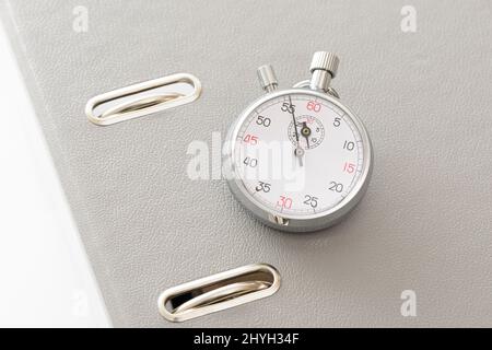 Yellow office folder on the chronometer. Stock Photo