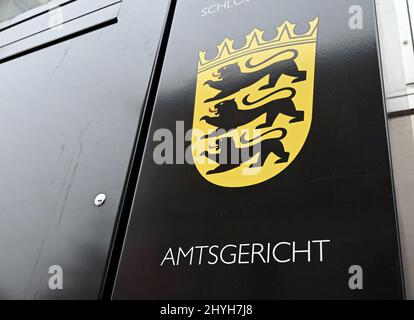 Karlsruhe, Germany. 15th Mar, 2022. In front of the Karlsruhe District Court, the lettering Amtsgericht and the coat of arms of Baden-Württemberg are displayed on a mailbox. A trial for tax evasion amounting to millions of euros was opened in the court. The defendant, a former managing director of a now insolvent kebab skewer manufacturer, is alleged to have evaded taxes in eight cases from 2017 to 2019 with a total loss amounting to millions. Credit: Uli Deck/dpa/Alamy Live News Stock Photo