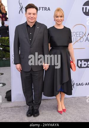 Mike Myers and Kelly Tisdale attending the 25th Annual Screen Actors Guild Awards held at the Shrine Auditorium Stock Photo