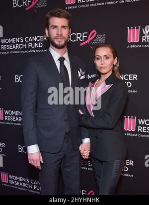 Liam Hemsworth and Miley Cyrus at An Unforgettable Evening benefiting the Women's Cancer Research Fund held at the Beverly Wilshire Hotel on February 28, 2019 in Beverly Hills, CA. Stock Photo