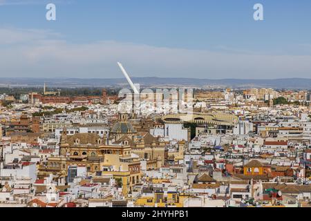 Editorial: SEVILLE, ANDALUSIA, SPAIN, OCTOBER 11, 2021 - Looking over Seville's roofs in the direction of Metropol Parasol seen from the Giralda Stock Photo