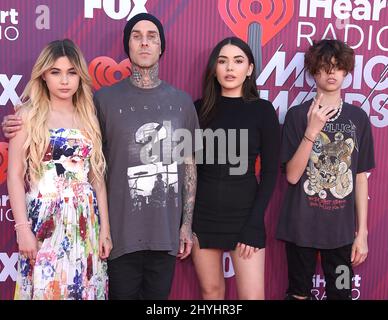 Travis Barker, Atiana de la Hoya, Alabama Luella Barker, Landon Asher Barker attending the 2019 iHeartRadio Music Awards held at Microsoft Theatre L.A Stock Photo