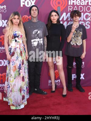 Travis Barker, Atiana de la Hoya, Alabama Luella Barker, Landon Asher Barker attending the 2019 iHeartRadio Music Awards held at Microsoft Theatre L.A Stock Photo