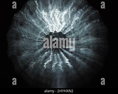 Blurry abstract silver star exploding in the darkness. Silver abstract background Stock Photo