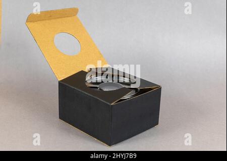 New AMD CPU cooler is in black cardboard box. Advanced Micro Devices ...