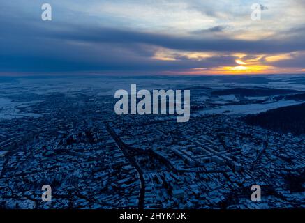 Aerial view of the beautiful cityscape of Reghin city, Romania at sunset Stock Photo