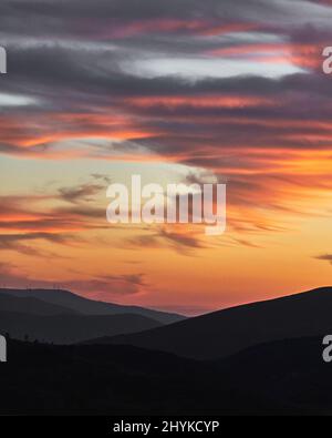 Golden sky at the sunset and hills silhouettes in gradients Stock Photo ...