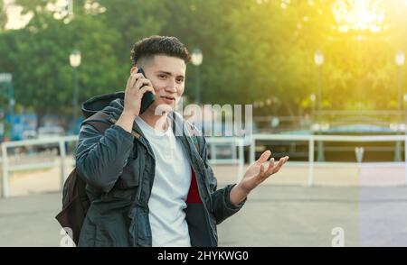 Man calling on the phone, young man calling on cell phone, latin guy calling on the phone Stock Photo