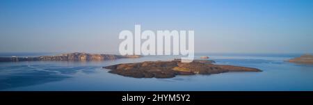 Drone shot, morning atmosphere, caldera, view of volcanic islands Nea Kameni, Palea Kameni and Aspronisi, view of southern tip of the island, sea Stock Photo