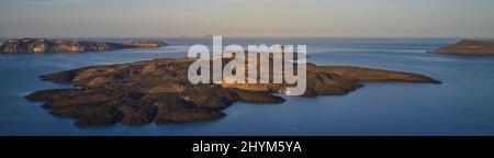 Drone shot, panorama, morning atmosphere, caldera, view of volcanic islands Nea Kameni, Palea Kameni and Aspronisi, view of southern tip of the Stock Photo