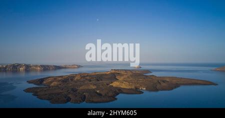 Drone shot, morning atmosphere, caldera, view of volcanic islands Nea Kameni, Palea Kameni and Aspronisi, view of southern tip of the island, sea Stock Photo