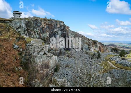 The Cheesewring rock stack on the edge of the remains of the disused Stowes Hill Quarry Cheesewring Quarry on Bodmin Moor in Cornwall. Stock Photo
