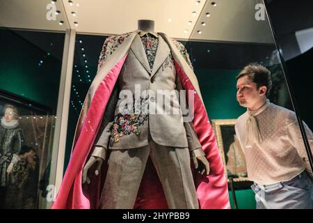 London, UK. 15th Mar, 2022. EMBARGOED until 16 March, 00.01 GMT. A custom suit with embroidered cloak and hot pink lining by Randi Rahm, worn by Billy Porter at the 2019 Golden Globes.The V&A's new exhibition 'Fashioning Masculinities: The Art of Menswear' presents around 100 looks from legendary designers and rising stars including Harris Reed, Gucci, Grace Wales Bonner and Raf Simons as well as 100 artworks across a wide range of media. Credit: Imageplotter/Alamy Live News Stock Photo