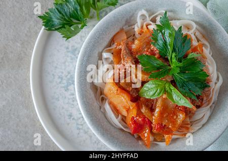 Hot Uighur dish served with herbs and spices. Stock Photo