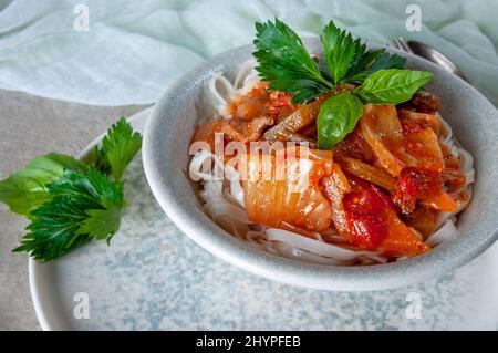 Hot Uighur dish served with herbs and spices. Stock Photo