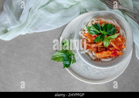 Hot Uighur dish served with herbs and spices. Stock Photo