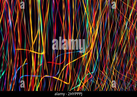 Abstract colorful background. Light painting lines. Colorful lights pattern on black background. Long exposure photography. Stock Photo